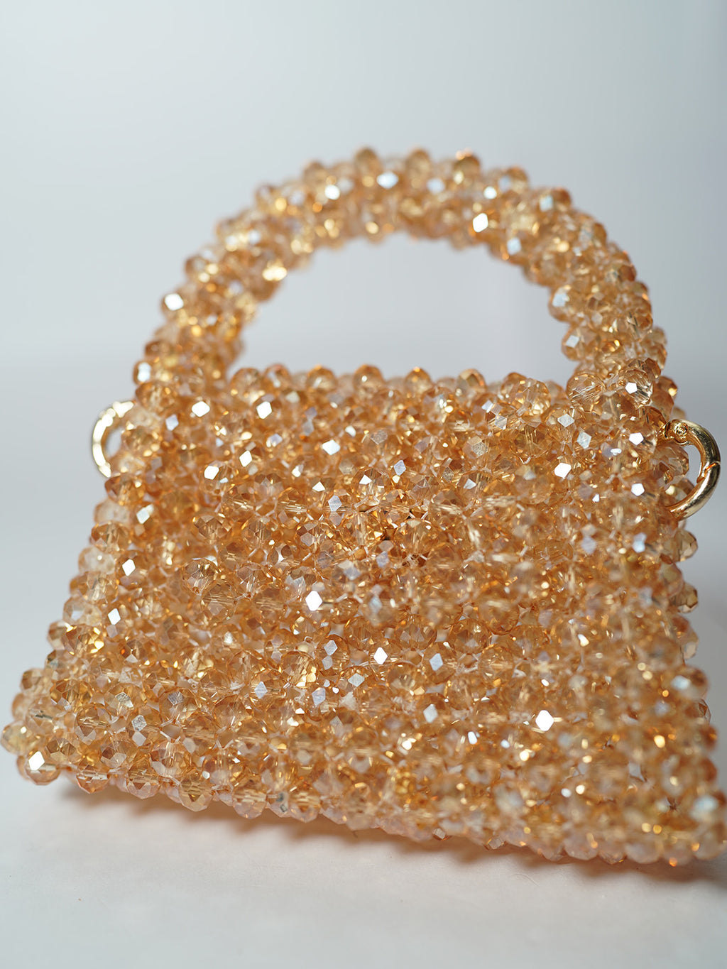 Gold mini sling bag