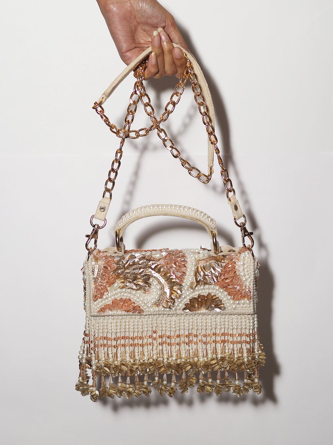 Peach rose gold clutch