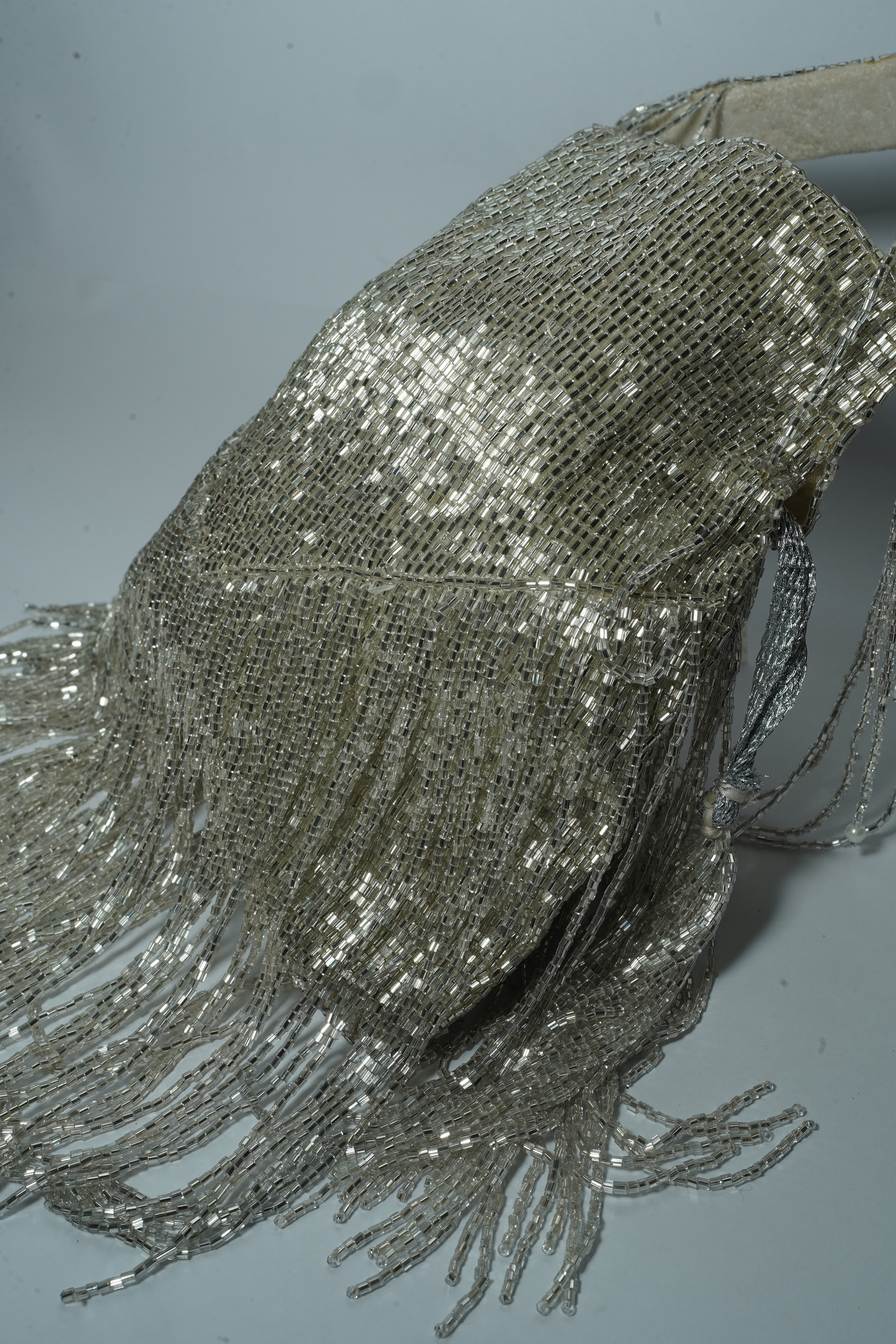 Silver long tassel potli bag