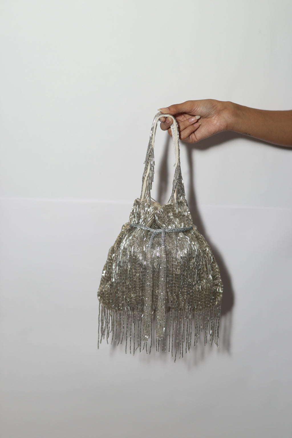 Silver long tassel potli bag