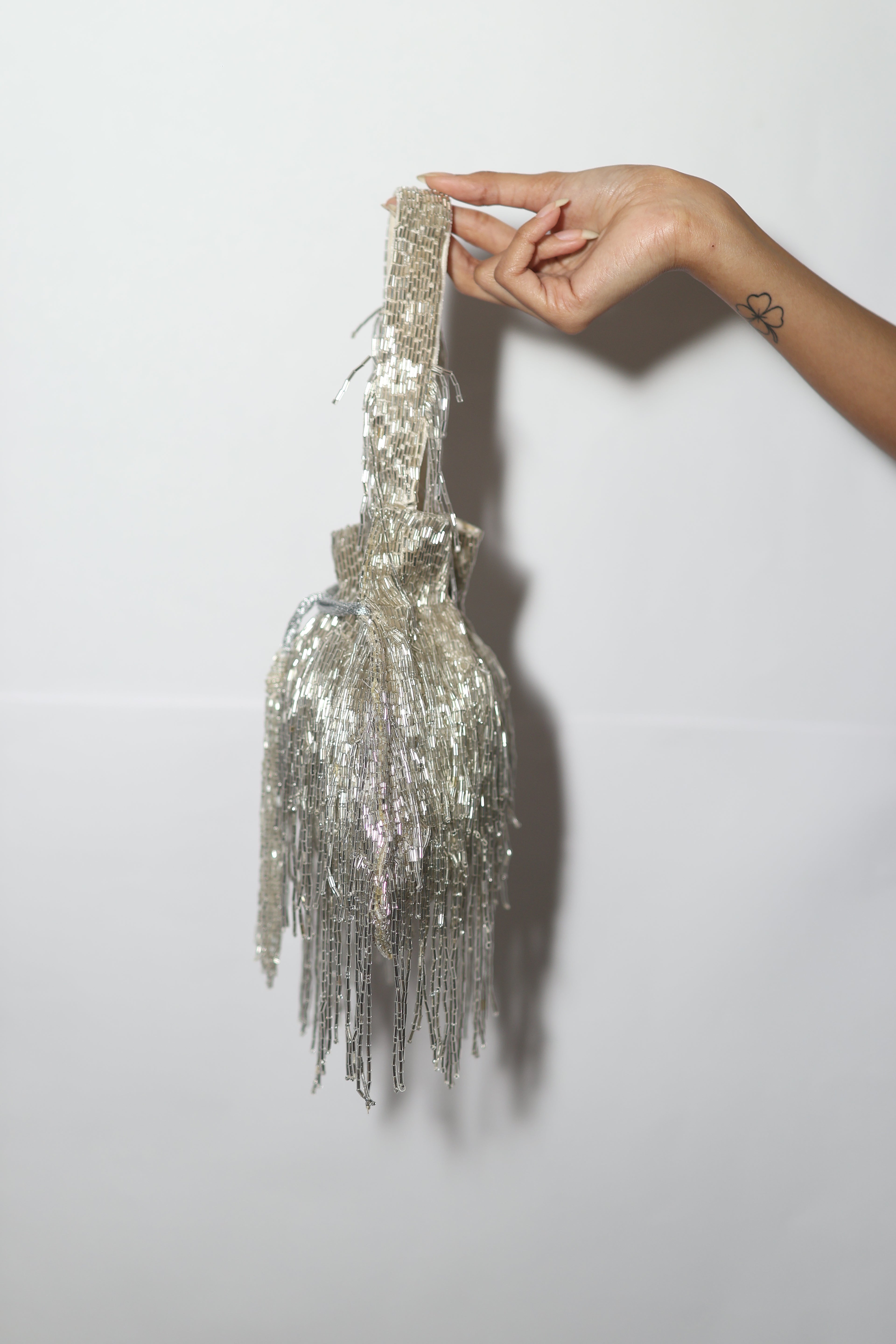 Silver long tassel potli bag